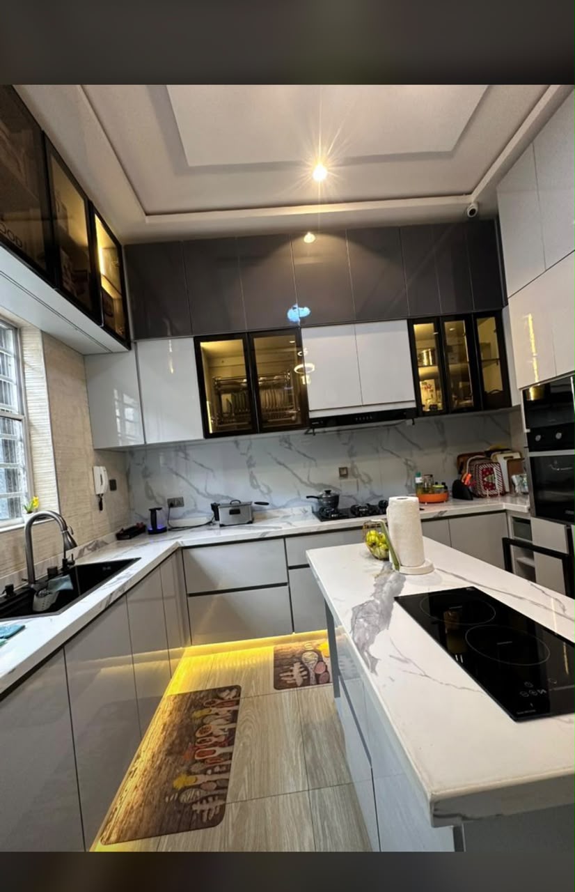 Fitted kitchen with cabinetry and illuminated worktops